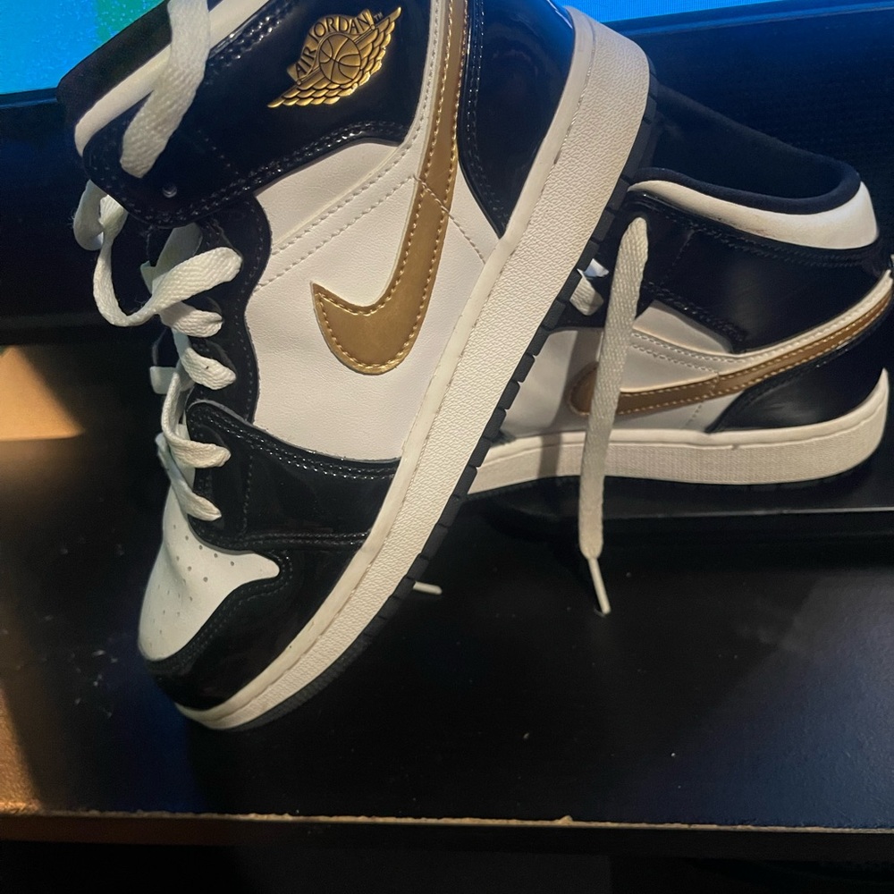 Nike Air Jordan Black and Gold High-Tops